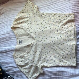 Crop t-shirt from pink. In size medium. Cream and yellow with green colors.